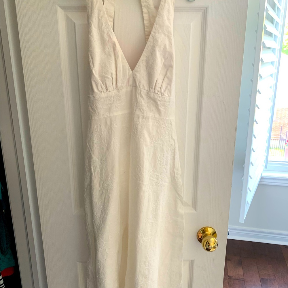 Anthropologie halter dress with all-over embroidery and hidden red embellishment